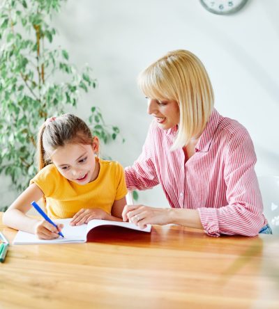 Mother,Or,Teacher,Teaching,Daughter,And,Helping,Her,With,Homework