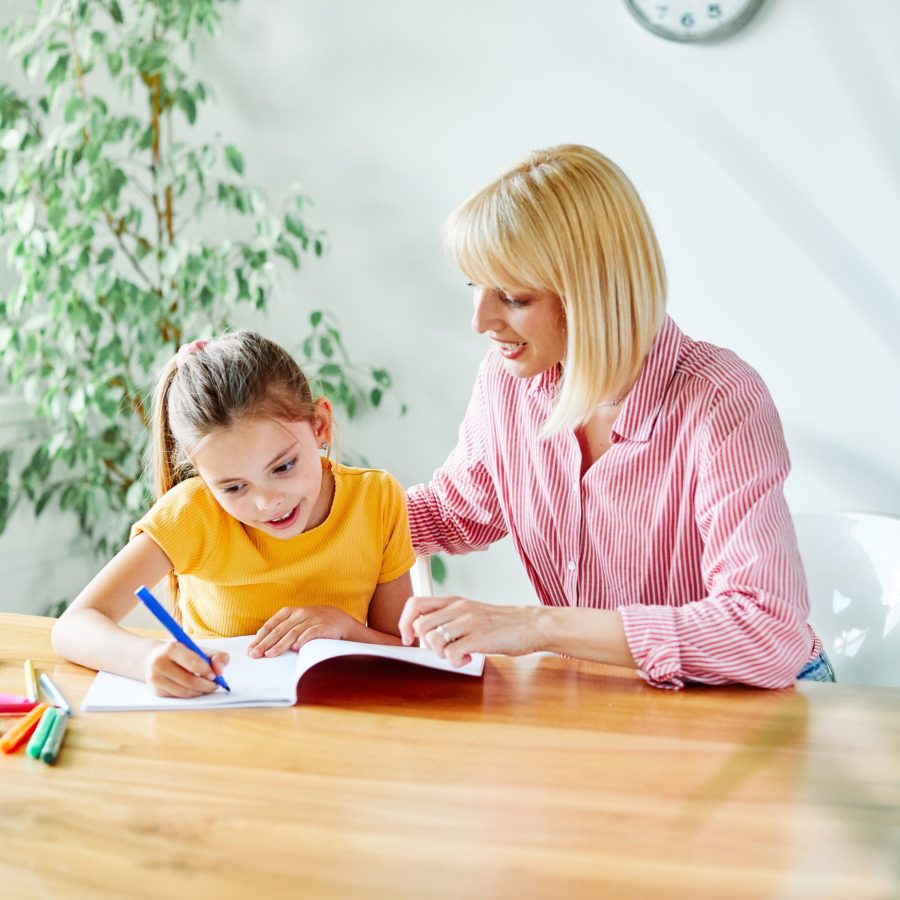 Mother,Or,Teacher,Teaching,Daughter,And,Helping,Her,With,Homework